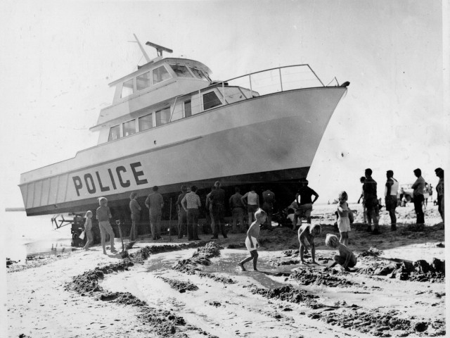 Police boat launching with many hands plus chn