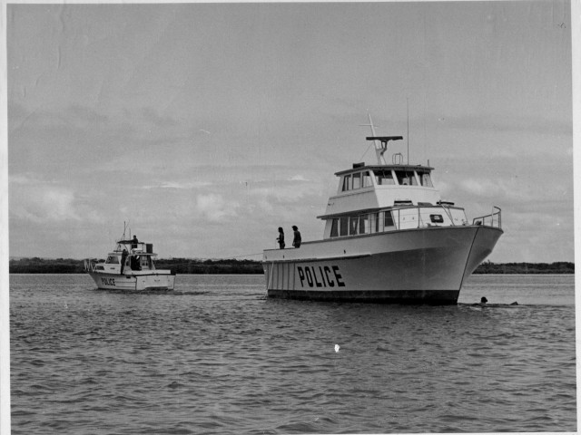 Police boats in the water